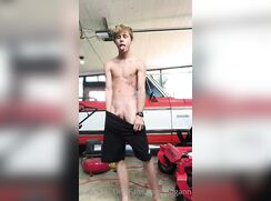 Hung twink jerks off in a car port