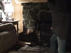 With daddy in front of the fireplace