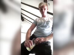 Blonde twink pisses in glass and drinks it