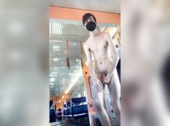 Twink strips completely naked on train