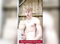 Blond handsome Aiden jerking off a huge dick in the backyard