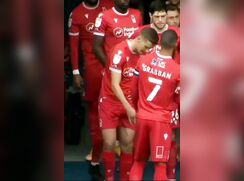 football player making sure his junk is there