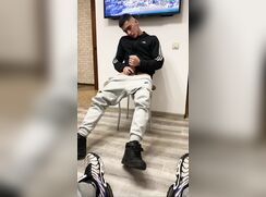 A DUDE JERKING IN FRONT OF A FRIEND