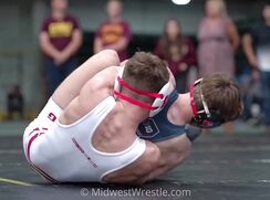 down hard, crashing. WRESTLING