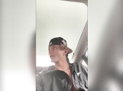 Cute blond guy pleasures himself in car