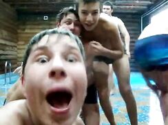 Cute boys dancing in the pool