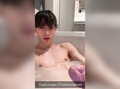 Cute guy jerking off in the bathtub