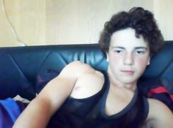 Twink with curly hair on the couch
