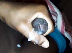 Young black teen plays with his cum