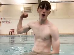 Ripped twink shows his dick in public swimming pool