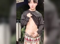 Cumming on the balcony