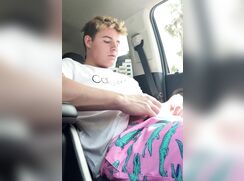 Blond boy jerking in the car