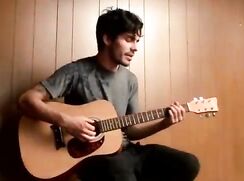 Sexy Guitarist plays his organ