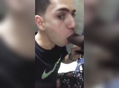 boy with black toy in public restroom