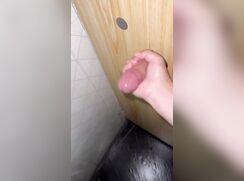 Jerking off a random guy in the bathroom