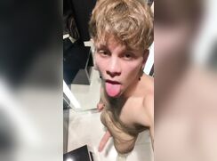 Handsome guy jerks off in the Fitting room