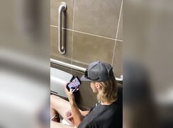 Spy a guy with a Huge dick jerking off in public toilet