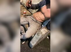 friends sucking a drunken fit boy in a park