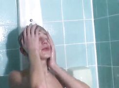 Sweet blonde takes a shower and suddenly gets horny