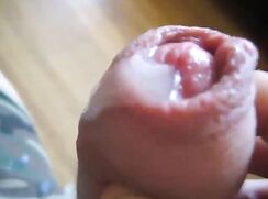 Guy stimulates his glans and cums