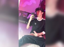 Young guy plays cock in his room.