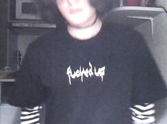 Goth femboy shows off dick