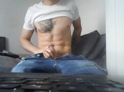 tattooed boy jerks off in his jeans