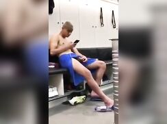 Watching porn and wanking off in the locker room