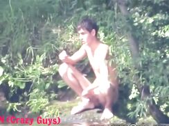 Dude jerk by a river