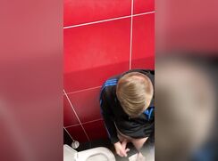 Spying on a blond guy cumming in the toilet