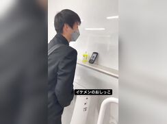 A male student is pissing in the toilet 9.
