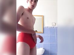 Red speedo twink wanks his dick