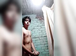 Latino jerks off in the shower.