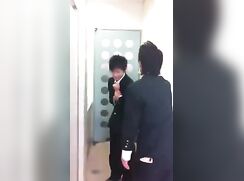 Male students play each other in the school's toilet.