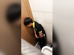 A male is ejaculating and masturbating in the toilet.