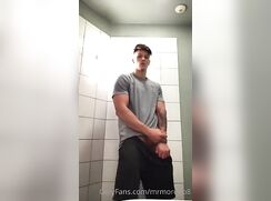 geogeous guy jacks at the public toillet