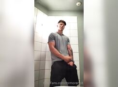 geogeous guy jacks at the public toillet