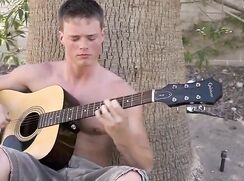 fit blonde get hornie guitar playing at the beach and jacks his big cut cock