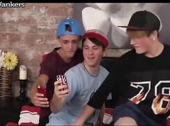 Three boy play around in bed