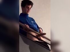 Teen boy flashes hard cock on the stairs