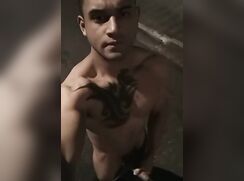 Tattooed Latino muscle guy strips and wanks on the street
