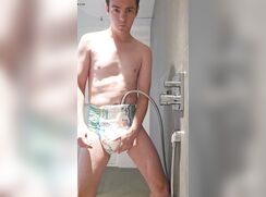 Filling his diaper in the shower