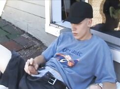 cute blonde jacking off on roof watching a vintage porn magazine