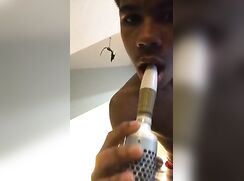Black boy sucking hairbrush