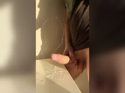 Slamming his big cock on his huge load