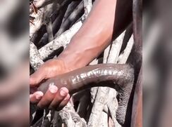 Black guy bathing outside