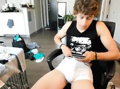 Smooth, tanned guy wanks on cam