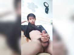 Chinese boy jerks and cums