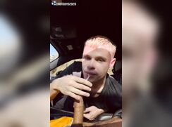 Blond slut sucks in a car