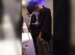 A male is pissing in the toilet 5